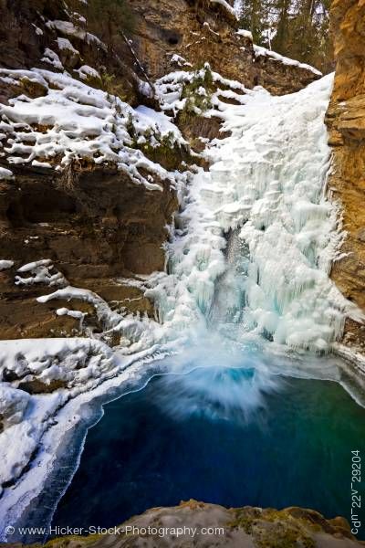 Stock photo of Partially Frozen Lower Falls Johnston Creek Winter Johnston Canyon Banff National Park Alberta Canad