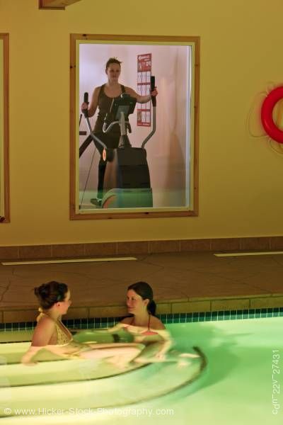Stock photo of Indoor pool women relaxing pool fitness