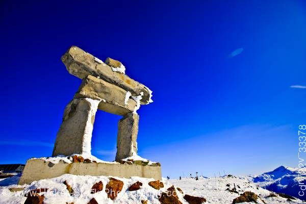 Stock photo of Large Inukshuk Ilanaaq Whistler Mountain Whistler British Columbia Canada Blue Sky
