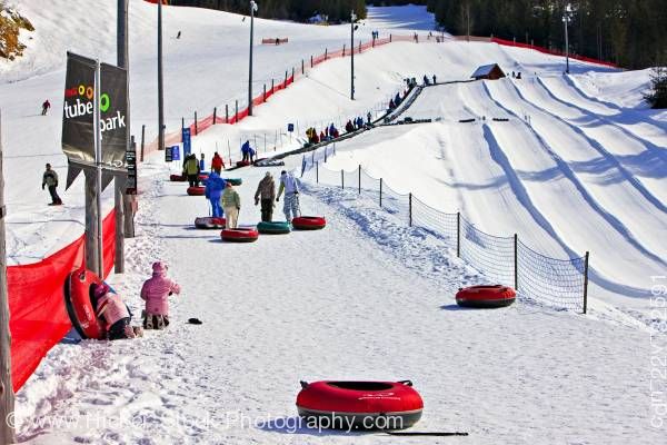 Stock photo of People at Coca Cola Tube Park Blackcomb Mountain Whistler British Columbia Canada