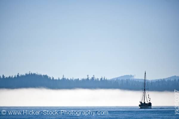 Stock photo of Sailboat in fog near Port Hardy Vancouver Island British Columbia Canada