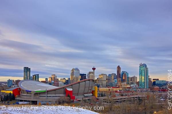 Stock photo of The Saddledome with high-rise buildings the Calgary Tower City of Calgary Alberta Canada
