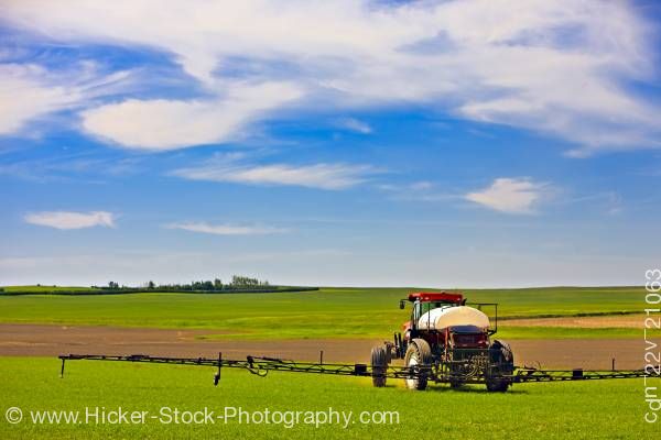 Stock photo of Tractor spraying crops Town of Rockglen Southern Saskatchewan Canada