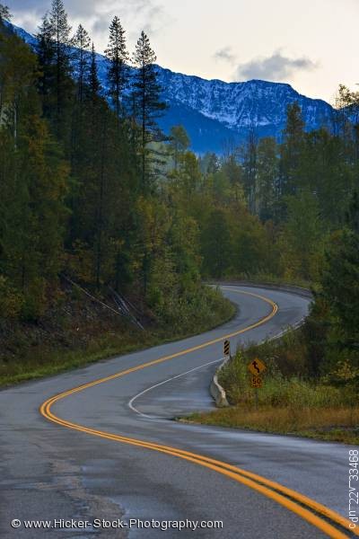 Stock photo of Winding road snowcapped mountain peaks Kootenay Canada